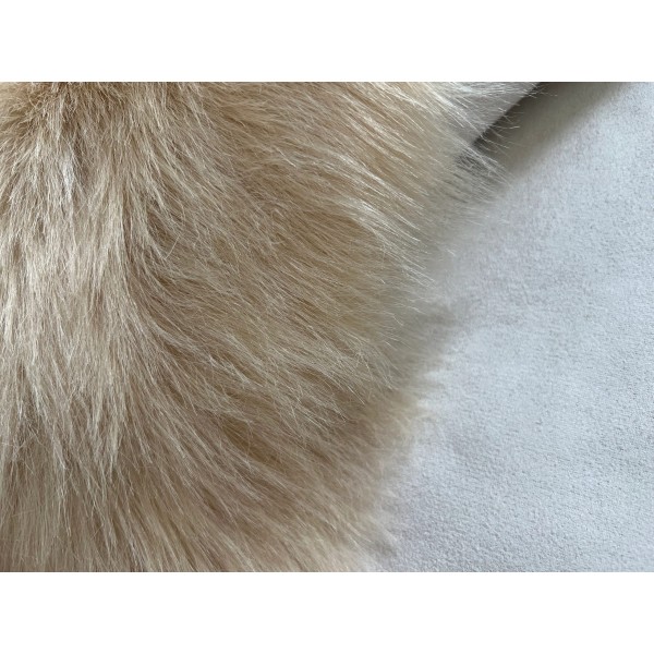 Light brown faux sheepskin rug